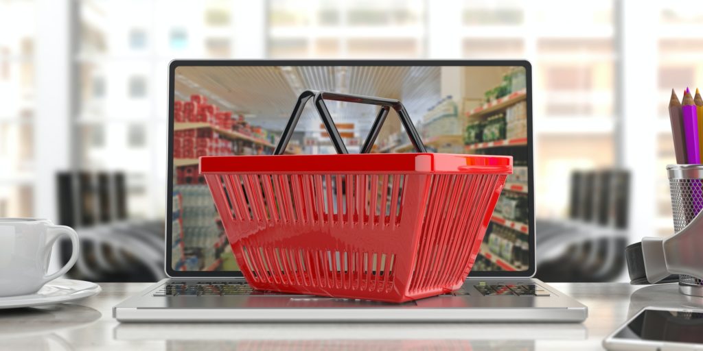 Supermarket online shopping. Shopping basket on a laptop.3d illustration